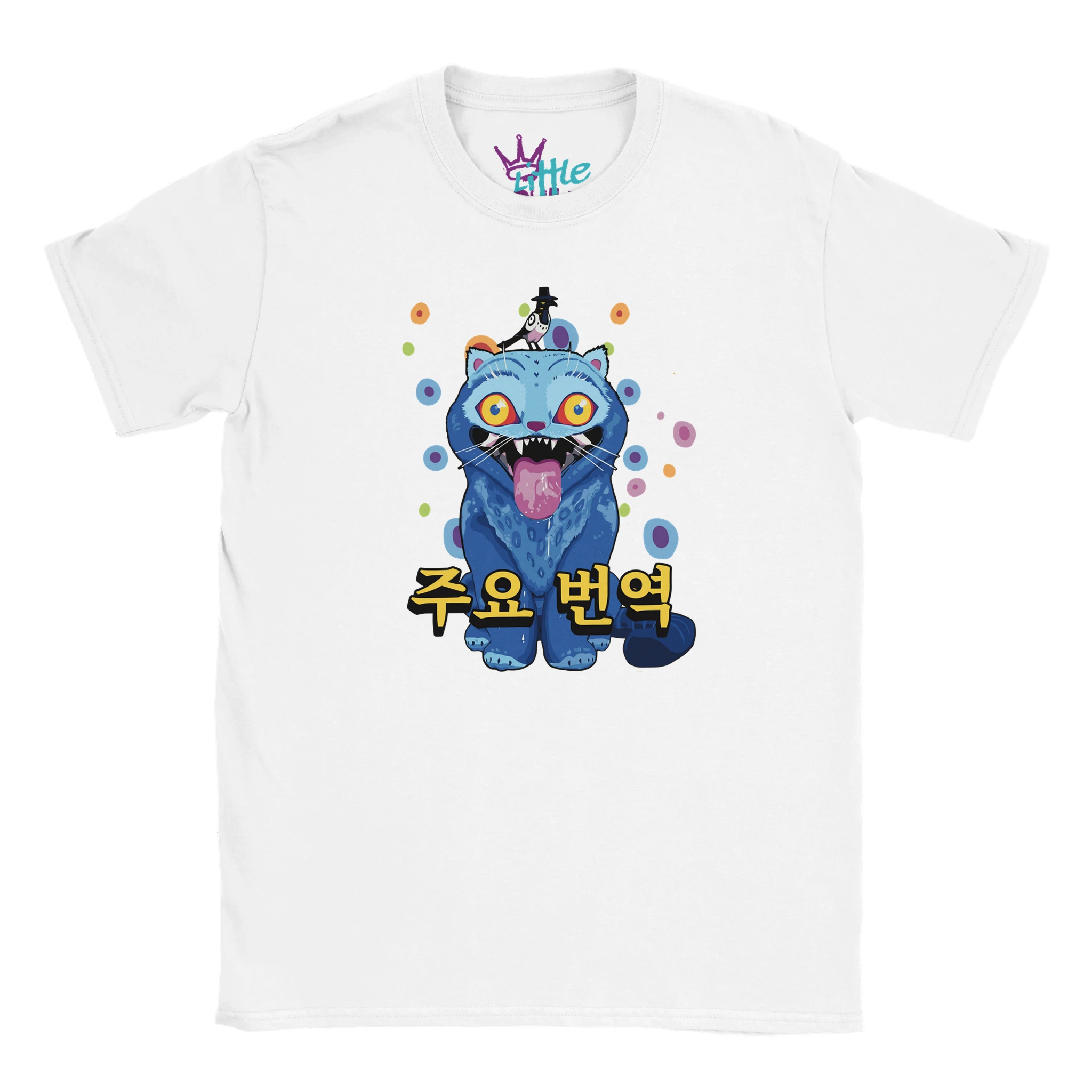 The Little Cult Derpy Polka Dots x Deokhu Kids T-Shirt in white features a blue cartoon creature with spots, playful yellow eyes, Korean text “주요 번역,” and a tiny figure on its head—perfect for kids and K-Pop fans!.